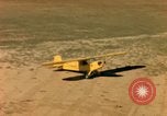 Image of Tuskagee pilot trainees practice taxiing in Piper cub airplanes Alabama United States USA, 1941, second 56 stock footage video 65675068170