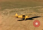 Image of Tuskagee pilot trainees practice taxiing in Piper cub airplanes Alabama United States USA, 1941, second 57 stock footage video 65675068170