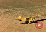 Image of Tuskagee pilot trainees practice taxiing in Piper cub airplanes Alabama United States USA, 1941, second 58 stock footage video 65675068170