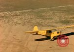 Image of Tuskagee pilot trainees practice taxiing in Piper cub airplanes Alabama United States USA, 1941, second 59 stock footage video 65675068170