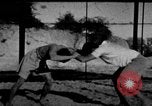 Image of Recruits wrestling at an Indian Army camp India, 1938, second 1 stock footage video 65675068241