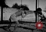 Image of Recruits wrestling at an Indian Army camp India, 1938, second 3 stock footage video 65675068241