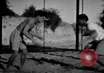 Image of Recruits wrestling at an Indian Army camp India, 1938, second 4 stock footage video 65675068241