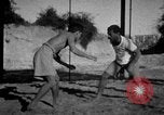 Image of Recruits wrestling at an Indian Army camp India, 1938, second 6 stock footage video 65675068241