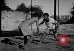Image of Recruits wrestling at an Indian Army camp India, 1938, second 7 stock footage video 65675068241