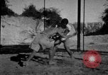 Image of Recruits wrestling at an Indian Army camp India, 1938, second 8 stock footage video 65675068241