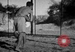 Image of Recruits wrestling at an Indian Army camp India, 1938, second 13 stock footage video 65675068241