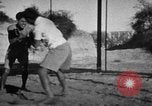 Image of Recruits wrestling at an Indian Army camp India, 1938, second 15 stock footage video 65675068241