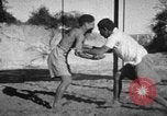 Image of Recruits wrestling at an Indian Army camp India, 1938, second 16 stock footage video 65675068241