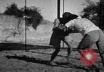 Image of Recruits wrestling at an Indian Army camp India, 1938, second 17 stock footage video 65675068241