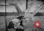 Image of Recruits wrestling at an Indian Army camp India, 1938, second 20 stock footage video 65675068241