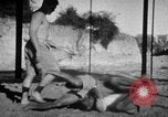 Image of Recruits wrestling at an Indian Army camp India, 1938, second 21 stock footage video 65675068241