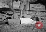 Image of Recruits wrestling at an Indian Army camp India, 1938, second 27 stock footage video 65675068241