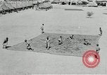 Image of folding a camouflage flat net United States USA, 1942, second 4 stock footage video 65675068405