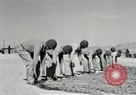 Image of folding a camouflage flat net United States USA, 1942, second 25 stock footage video 65675068405