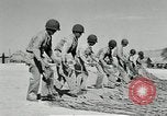Image of folding a camouflage flat net United States USA, 1942, second 27 stock footage video 65675068405