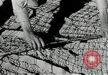 Image of folding a camouflage flat net United States USA, 1942, second 32 stock footage video 65675068405