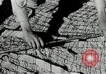 Image of folding a camouflage flat net United States USA, 1942, second 33 stock footage video 65675068405