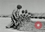 Image of folding a camouflage flat net United States USA, 1942, second 36 stock footage video 65675068405