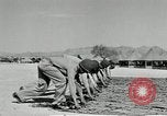 Image of folding a camouflage flat net United States USA, 1942, second 37 stock footage video 65675068405