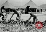 Image of folding a camouflage flat net United States USA, 1942, second 38 stock footage video 65675068405