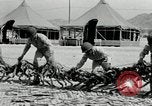 Image of folding a camouflage flat net United States USA, 1942, second 39 stock footage video 65675068405