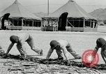 Image of folding a camouflage flat net United States USA, 1942, second 40 stock footage video 65675068405
