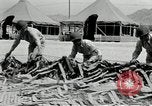 Image of folding a camouflage flat net United States USA, 1942, second 41 stock footage video 65675068405