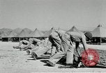 Image of folding a camouflage flat net United States USA, 1942, second 43 stock footage video 65675068405