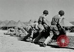 Image of folding a camouflage flat net United States USA, 1942, second 44 stock footage video 65675068405