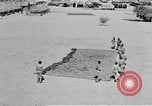 Image of folding a camouflage flat net United States USA, 1942, second 53 stock footage video 65675068405