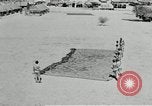 Image of folding a camouflage flat net United States USA, 1942, second 54 stock footage video 65675068405
