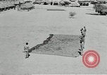 Image of folding a camouflage flat net United States USA, 1942, second 55 stock footage video 65675068405