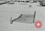 Image of folding a camouflage flat net United States USA, 1942, second 56 stock footage video 65675068405