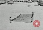 Image of folding a camouflage flat net United States USA, 1942, second 57 stock footage video 65675068405