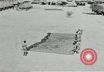 Image of folding a camouflage flat net United States USA, 1942, second 59 stock footage video 65675068405