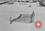 Image of folding a camouflage flat net United States USA, 1942, second 60 stock footage video 65675068405