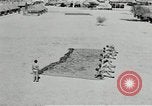 Image of folding a camouflage flat net United States USA, 1942, second 61 stock footage video 65675068405