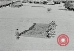 Image of folding a camouflage flat net United States USA, 1942, second 62 stock footage video 65675068405