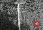 Image of activities near waterfall United States USA, 1916, second 3 stock footage video 65675068418
