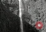 Image of activities near waterfall United States USA, 1916, second 8 stock footage video 65675068418