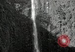 Image of activities near waterfall United States USA, 1916, second 10 stock footage video 65675068418