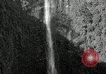 Image of activities near waterfall United States USA, 1916, second 11 stock footage video 65675068418