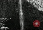 Image of activities near waterfall United States USA, 1916, second 17 stock footage video 65675068418