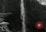 Image of activities near waterfall United States USA, 1916, second 20 stock footage video 65675068418