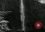 Image of activities near waterfall United States USA, 1916, second 21 stock footage video 65675068418