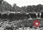 Image of activities near waterfall United States USA, 1916, second 24 stock footage video 65675068418