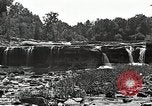 Image of activities near waterfall United States USA, 1916, second 25 stock footage video 65675068418