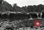 Image of activities near waterfall United States USA, 1916, second 26 stock footage video 65675068418