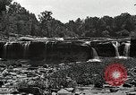 Image of activities near waterfall United States USA, 1916, second 27 stock footage video 65675068418